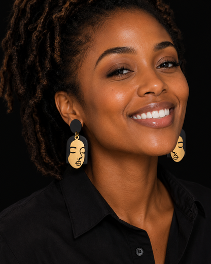 Model with locs wearing handmade statement earrings